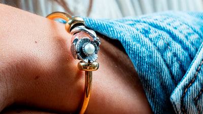 bangle with framed by flower bead